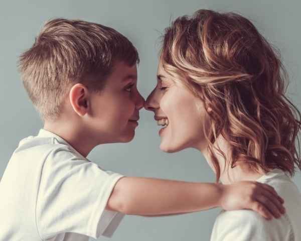 Mother and son sharing an Eskimo kiss that indicates Early Childhood Development