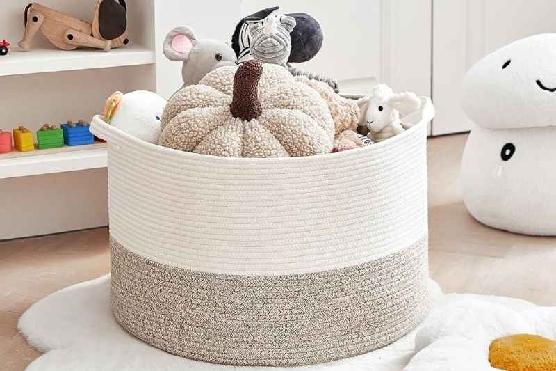 Soft cotton rope basket holding plush toys and blankets — a cozy and stylish storage basket for kids’ rooms.