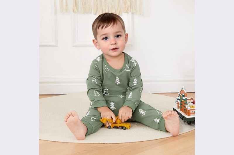 Baby boy standing and wearing the Kupretty Baby Boy Christmas Outfit Toddler Winter Clothes, featuring a long-sleeve crewneck sweatshirt with festive design and matching pants; cozy and stylish infant and toddler Christmas outfit for holiday photos, family gatherings, and festive celebrations.